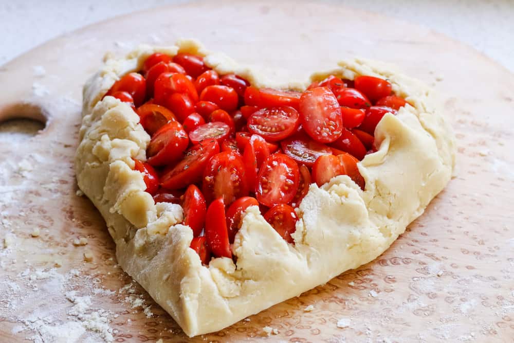 http://www.prettyprudent.com/wp-content/uploads/2018/01/Valentines-Recipe-Heart-Shaped-Tomato-Galette-6.jpg